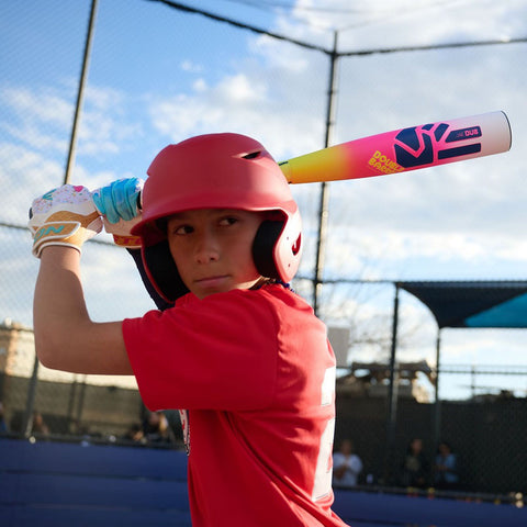 Youth player holding the Easton Dub USSSA bat